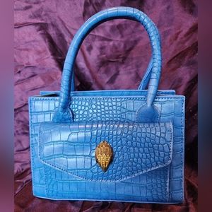 Blue croc embossed handbag with hawk clasp
